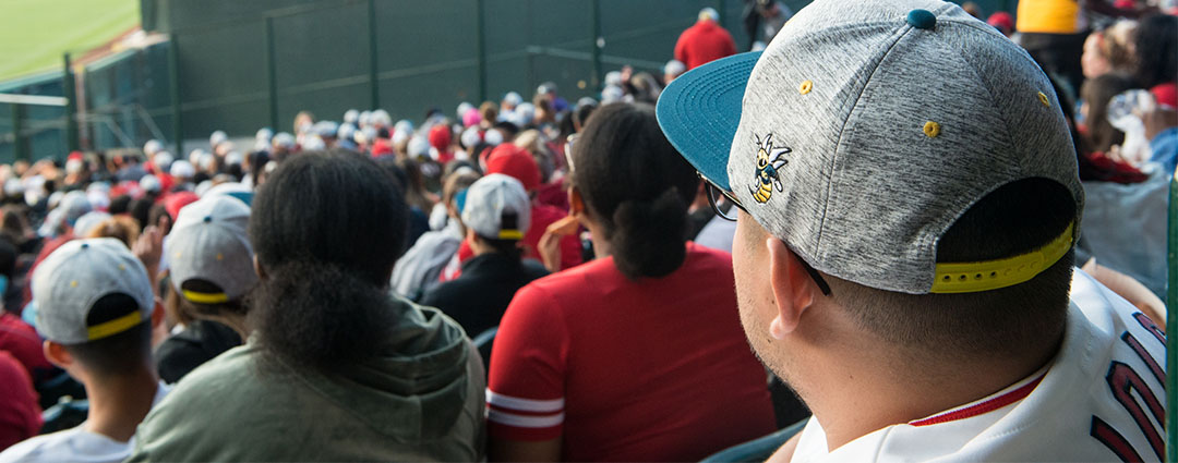 Man wearing Fullerton College hat at Angels game
