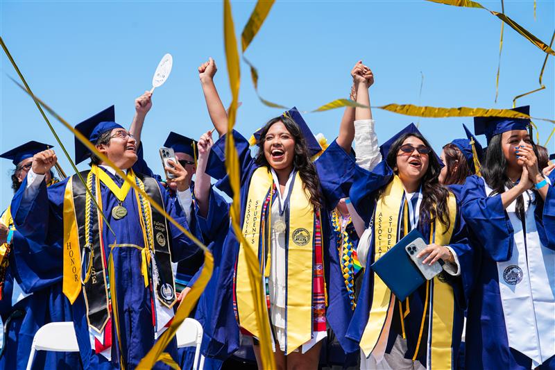 Group of Fullerton College Students smiling during commencement
